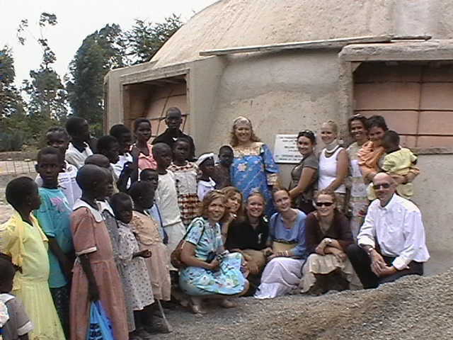 Work crew, children and leaders of WYI gather in front of Monolithic EcoShell which will soon be home to the children.