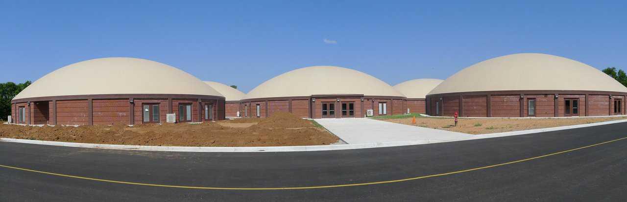 In 2011, construction began on Locust Grove’s new elementary school – a complex of five, interconnected Monolithic Domes designed by Architect Lee Gray of Salt Lake City, Utah.
  See: http://www.monolithic.com/stories/feature-school-locust-grove-oklahoma