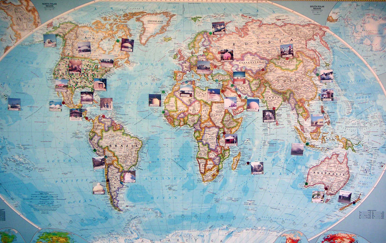 Visitors walking through our front door can immediately see Our Map. It’s a full color, National Geographic map of the world, given to us by employees and friends as a Christmas gift.