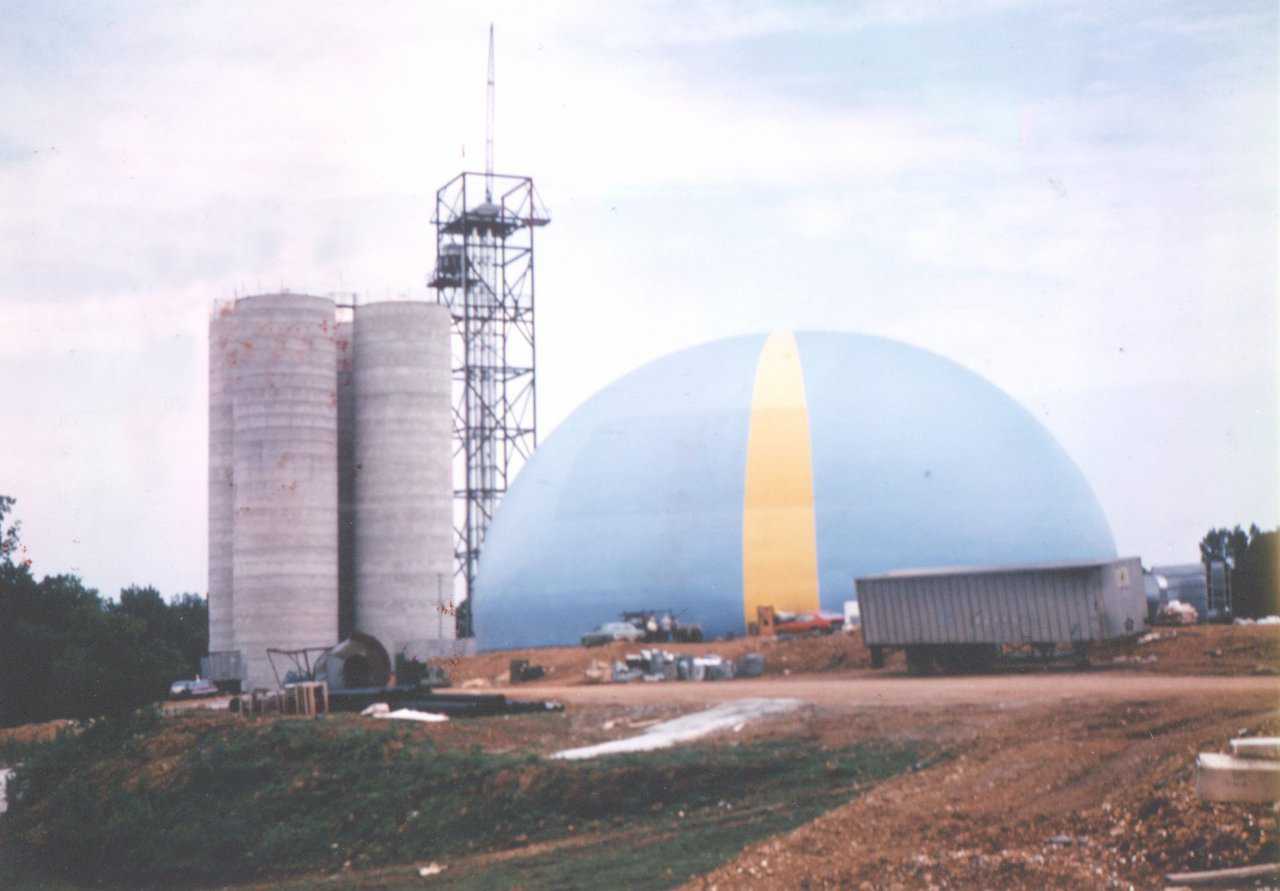 The Wheeler Grain Storage was built in 1982 near Athens, Alabama. This dome has a diameter of 150’, a height of 75’ and an excavated portion of 20’ under the dome. That excavated portion increased the volume for storing grain. It was outfitted with a tunnel for extraction, and it had a fan system for aerating the grain.
