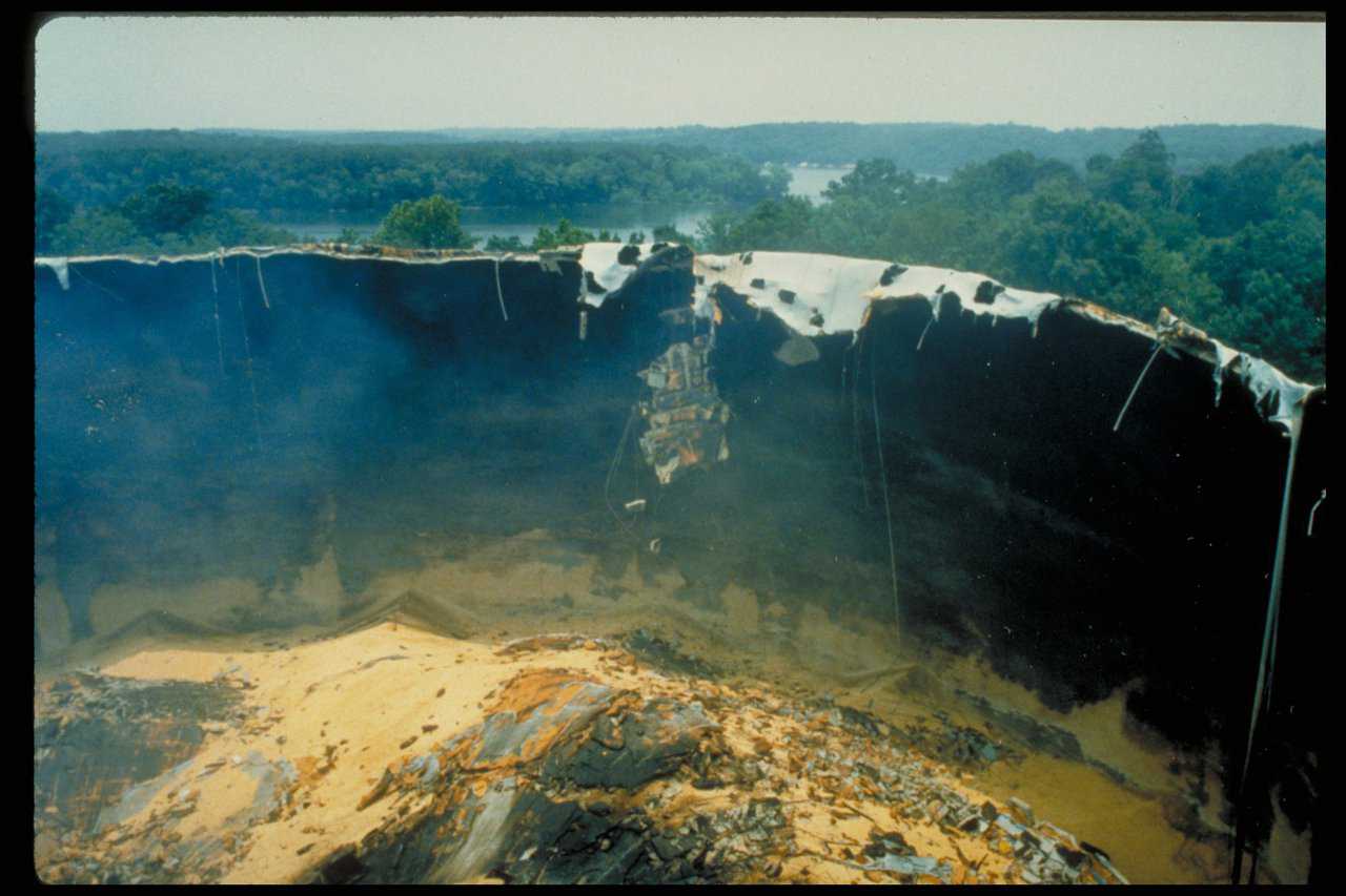 Wheeler Grain Storage: The grain did a slow burn for several months, while the owner and his team looked for a way to stop it. They were told it would explode, and one night it did! It awakened people four miles away! Note: The lower shell’s super-strong wall held the pressure from the methane explosion, and the top blew off. This is typical. The release of pressure tends to drag the broken roof section back into the dome. Almost no concrete landed outside the floor area.