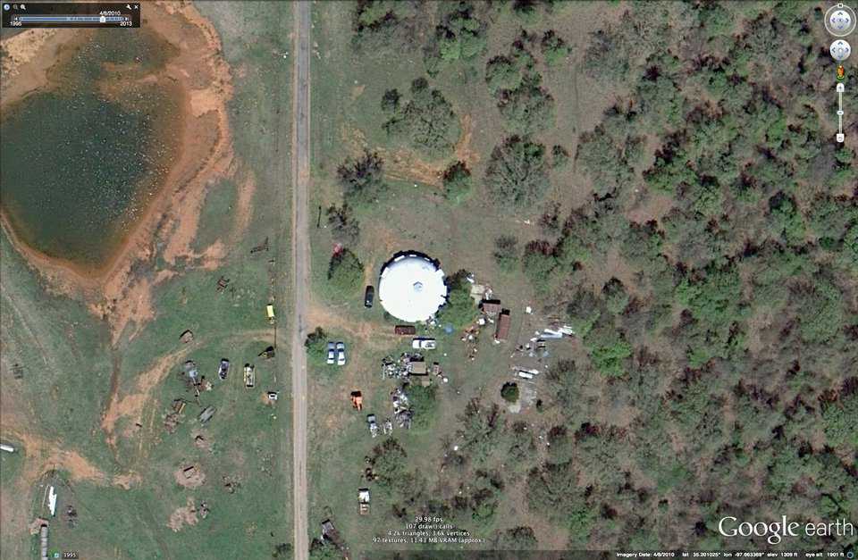 BEFORE: A satellite image one year before the tornado. Notice all the trees around and to the east of the dome.