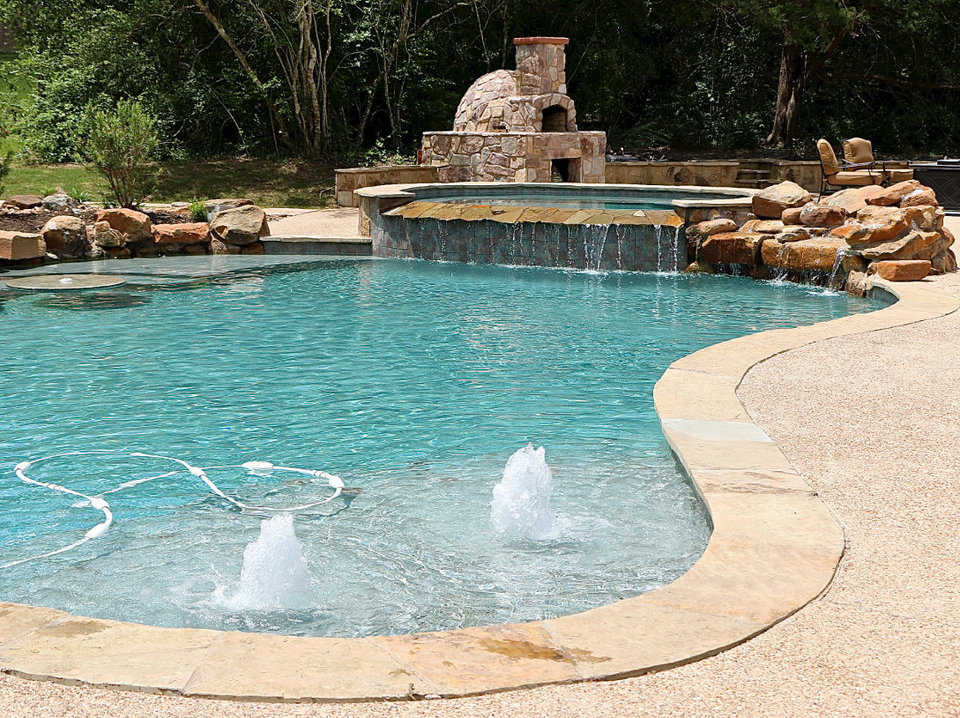 The Monolithic Dome Home’s aesthetically pleasing curves are complemented by the s-curved backyard pool.