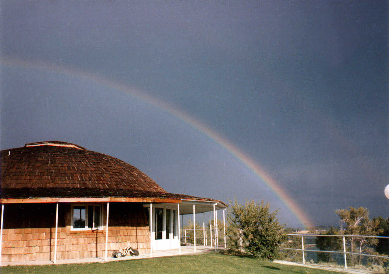 A rainbow echoes the shape of the monolithic dome, built for David South’s mother, Marjorie, on the South Menan Butte in Idaho—1977