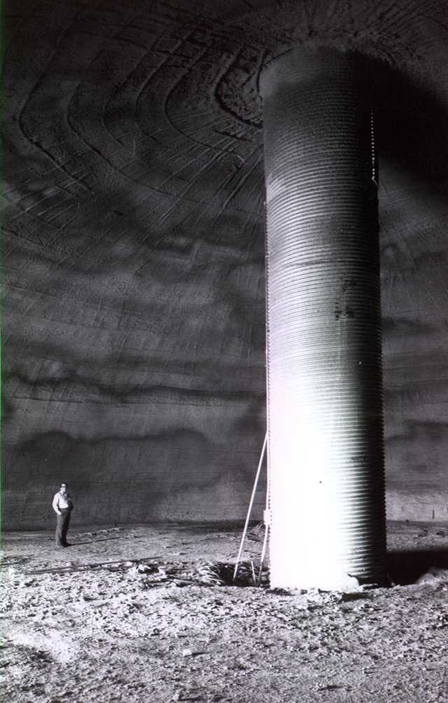 David B. South standing in his newly-constructed dome potato cellar, the first dome ever constructed using Monolithic’s patented construction process. April 1976.