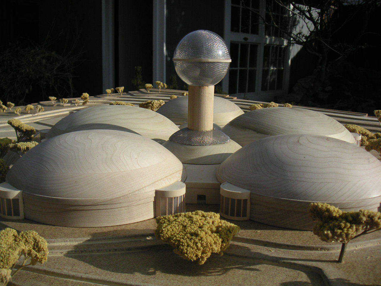 A complex of 5 Monolithic Domes — Each dome houses a specific group or activity.