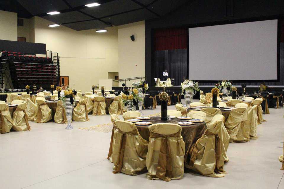 The seats pulled back and more tables and chairs set up for a banquet.