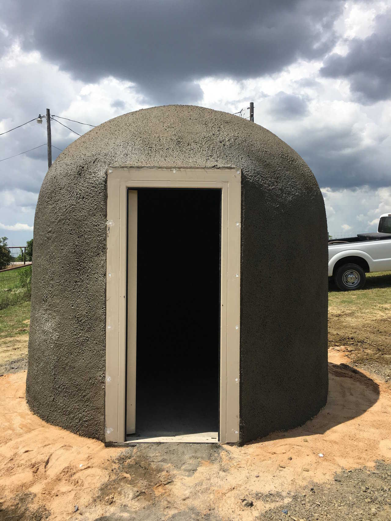 Three concrete piers — about five feet deep — anchor this newly completed Ecoshell storm shelter.