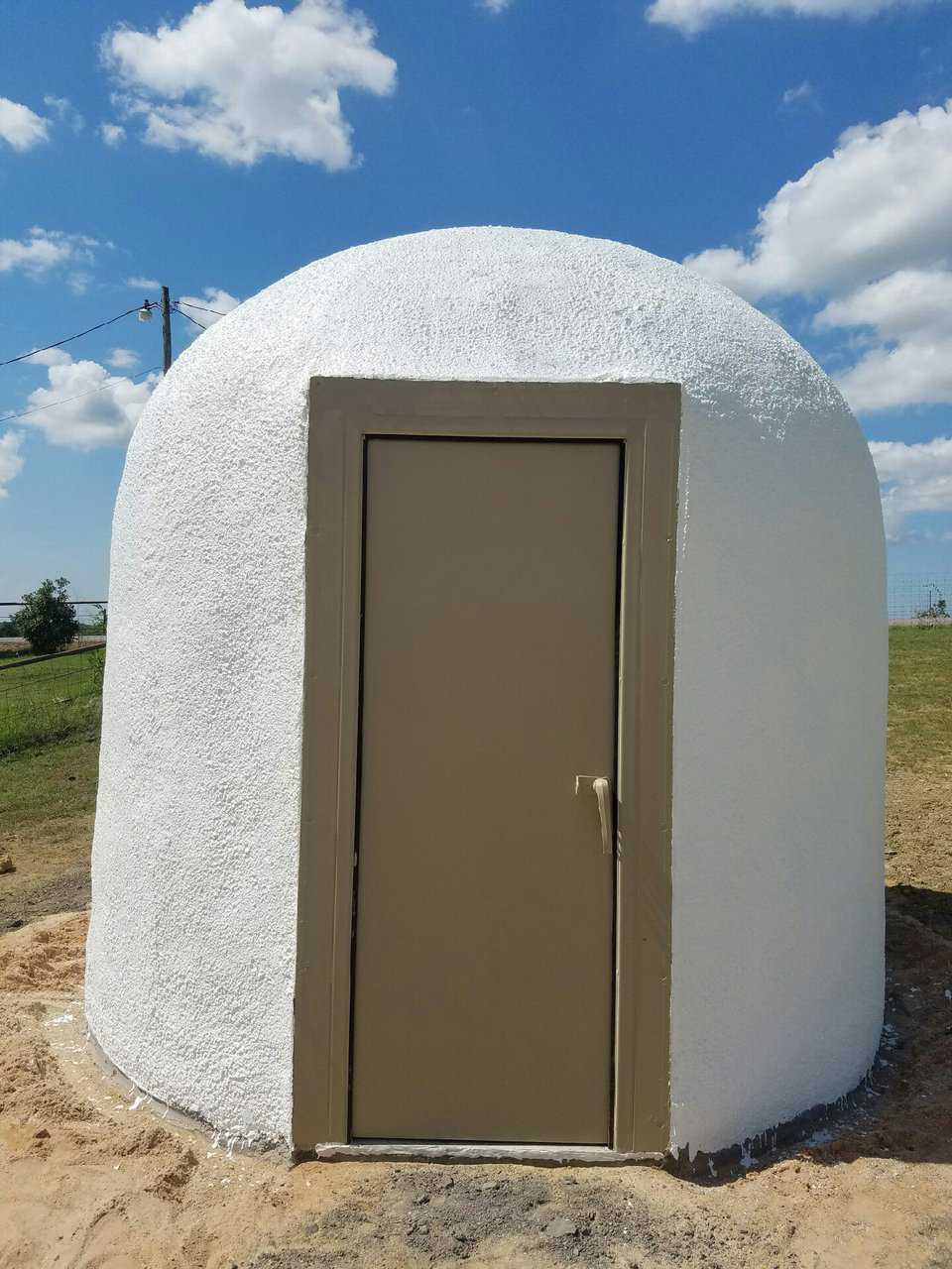 The Tornado Tamer storm door completes the tornado shelter.