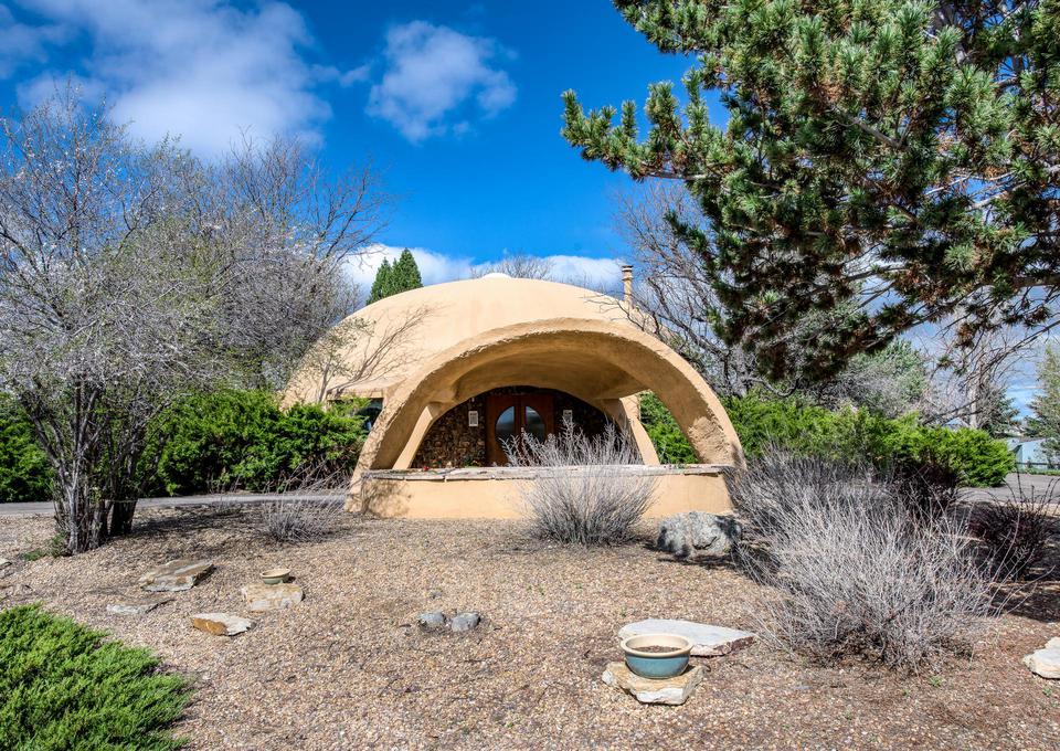 Low maintenance landscaping compliments the exterior.