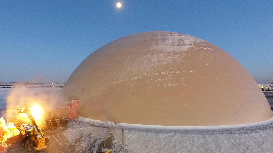 Drone view of snow covered, 182-foot diameter dome in Alberta, Canada.