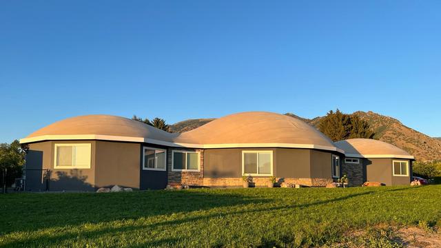 The setting sun lights Arcadia Dome Home.