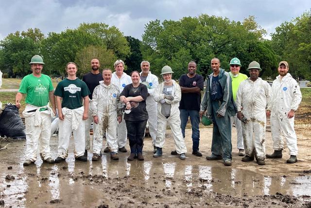 The attendees of the Fall 2023 Dome Builders Workshop take a break after learning to spray shotcrete.